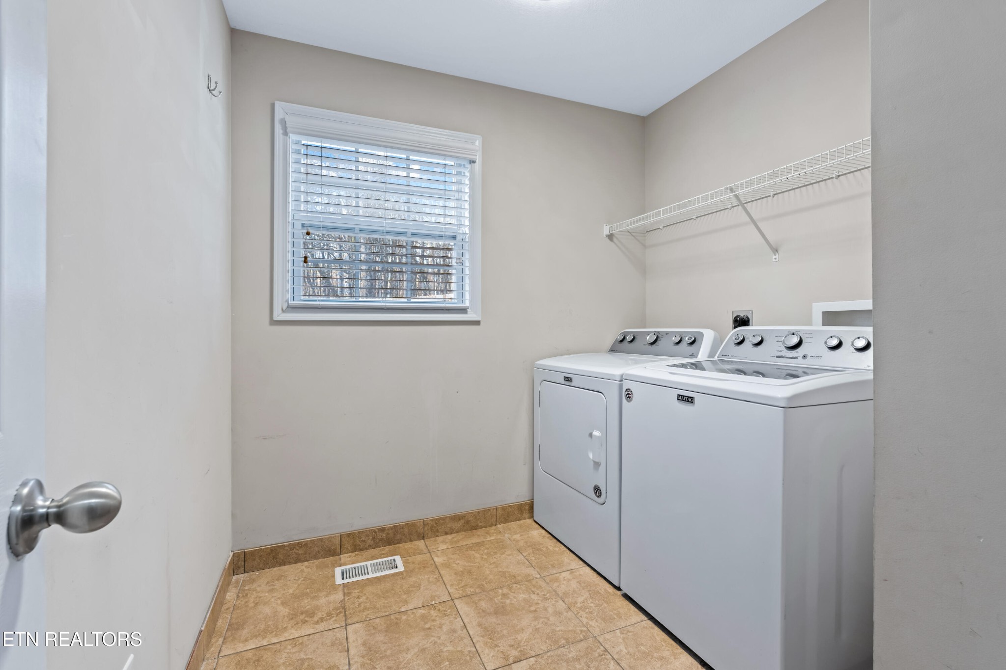2805 Porch Swing Road Knoxville, TN 37938 - Photo 13 of 48 a utility room with closet dryer and washer