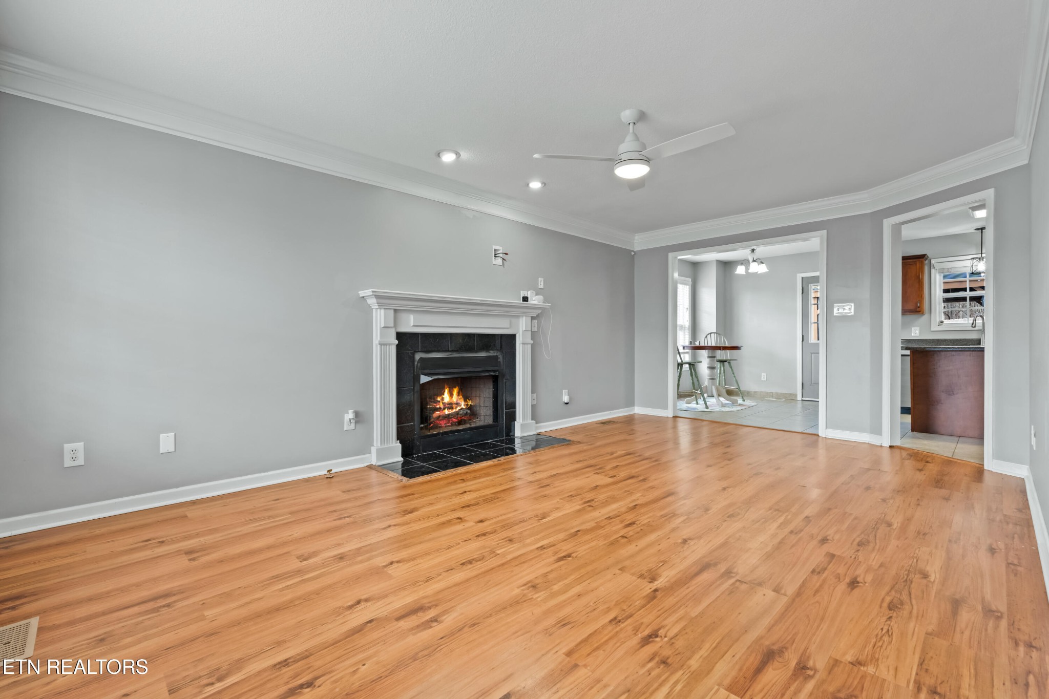 2805 Porch Swing Road Knoxville, TN 37938 - Photo 15 of 48 a view of empty room with wooden floor and fireplace