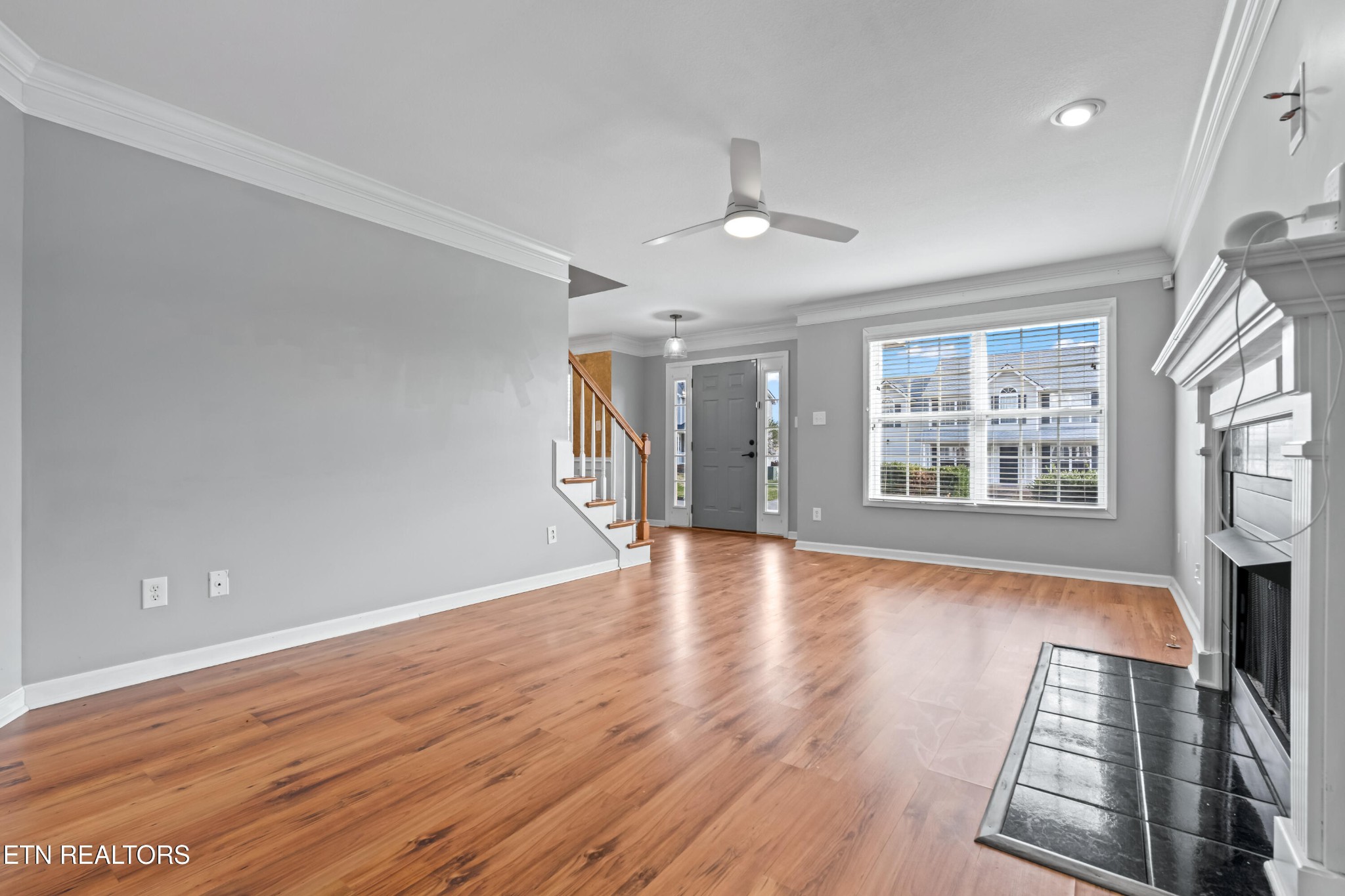 2805 Porch Swing Road Knoxville, TN 37938 - Photo 17 of 48 a view of an empty room with wooden floor and a window