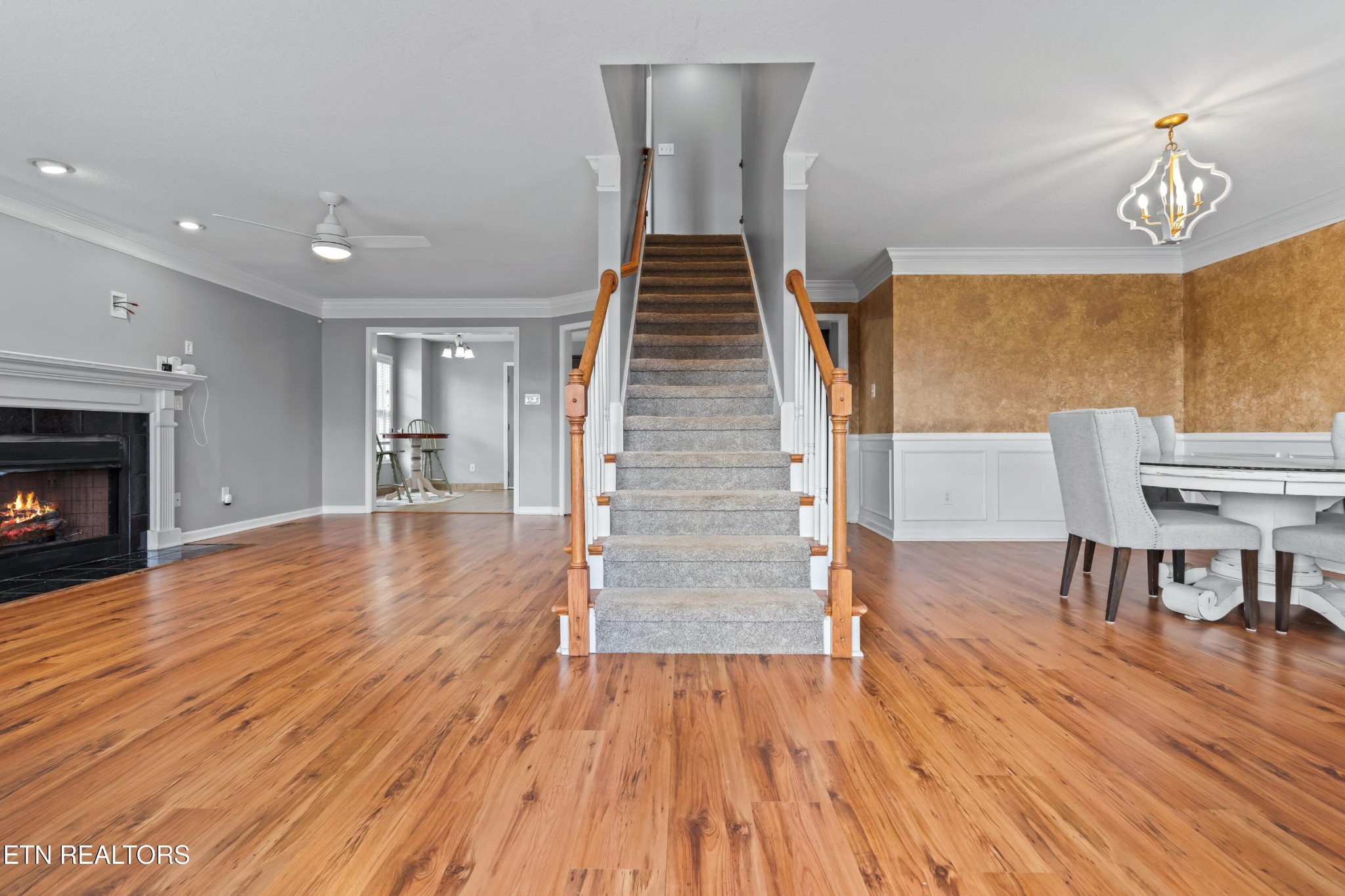 2805 Porch Swing Road Knoxville, TN 37938 - Photo 19 of 48 a view of a livingroom with wooden floor and staircase