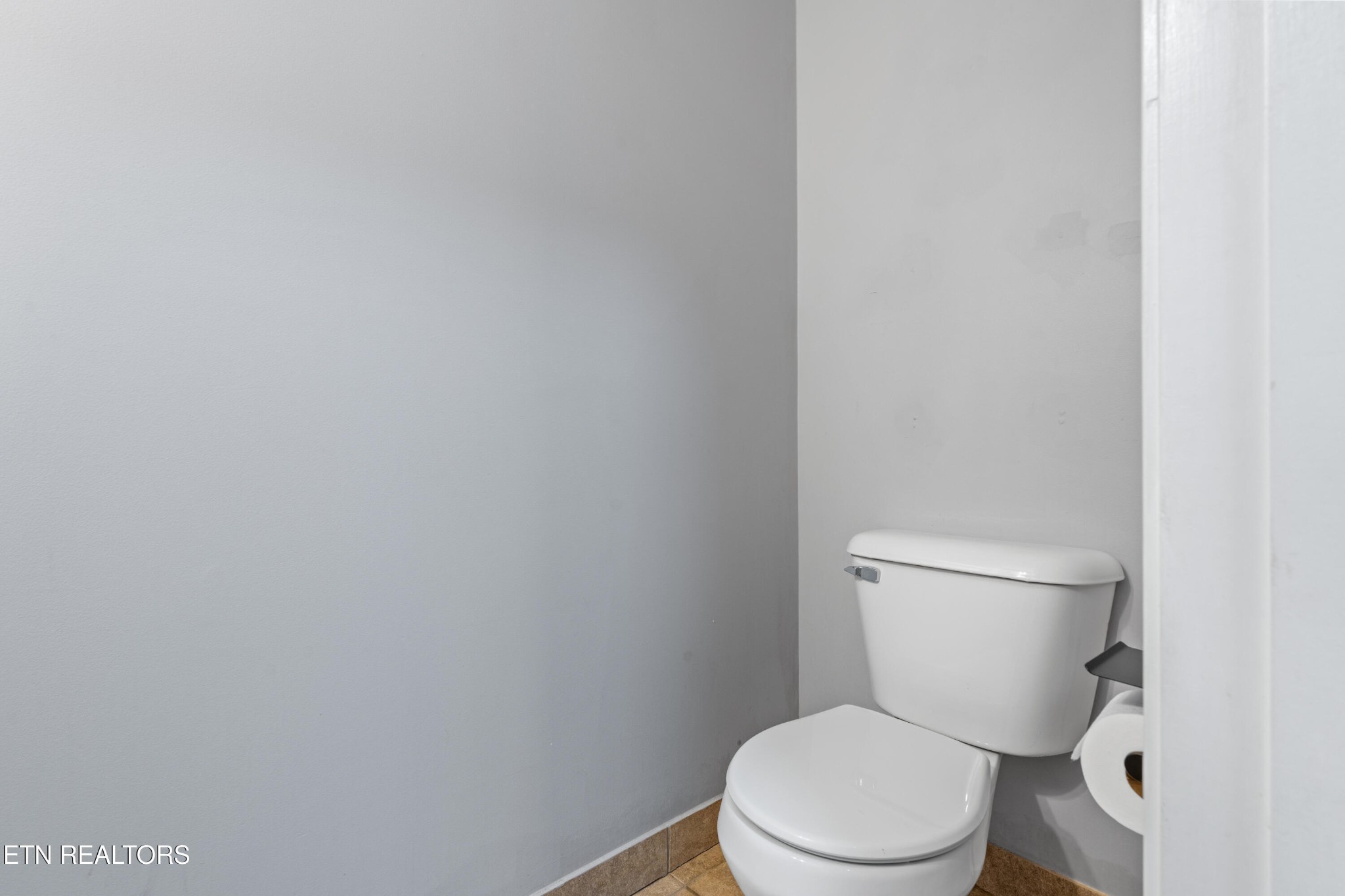 2805 Porch Swing Road Knoxville, TN 37938 - Photo 23 of 48 a white toilet sitting next to a white wall