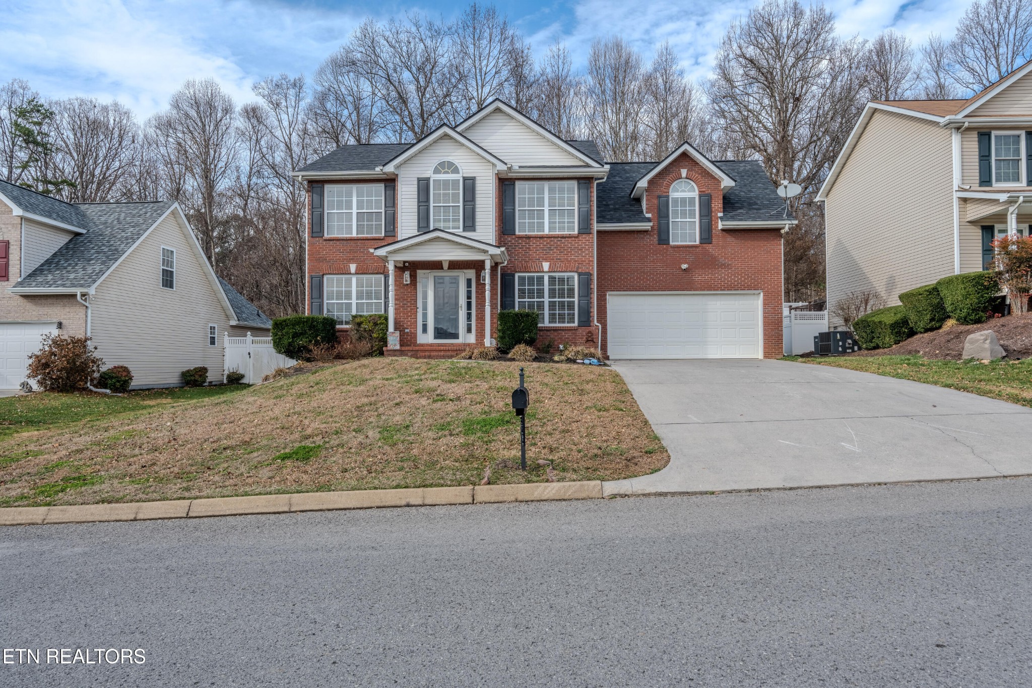 2805 Porch Swing Road Knoxville, TN 37938 - Photo 3 of 48 a front view of a house with a yard