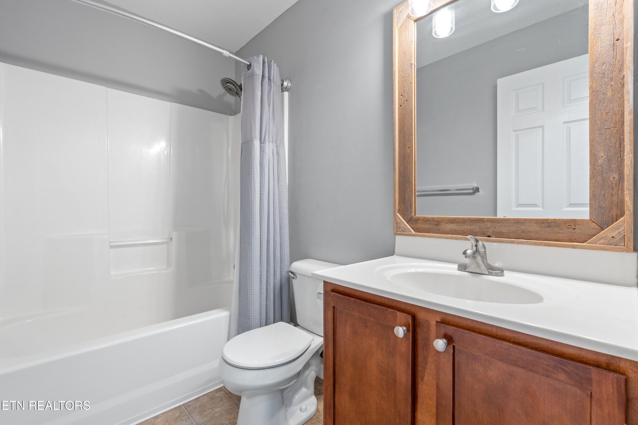 2805 Porch Swing Road Knoxville, TN 37938 - Photo 33 of 48 a bathroom with a sink toilet and shower