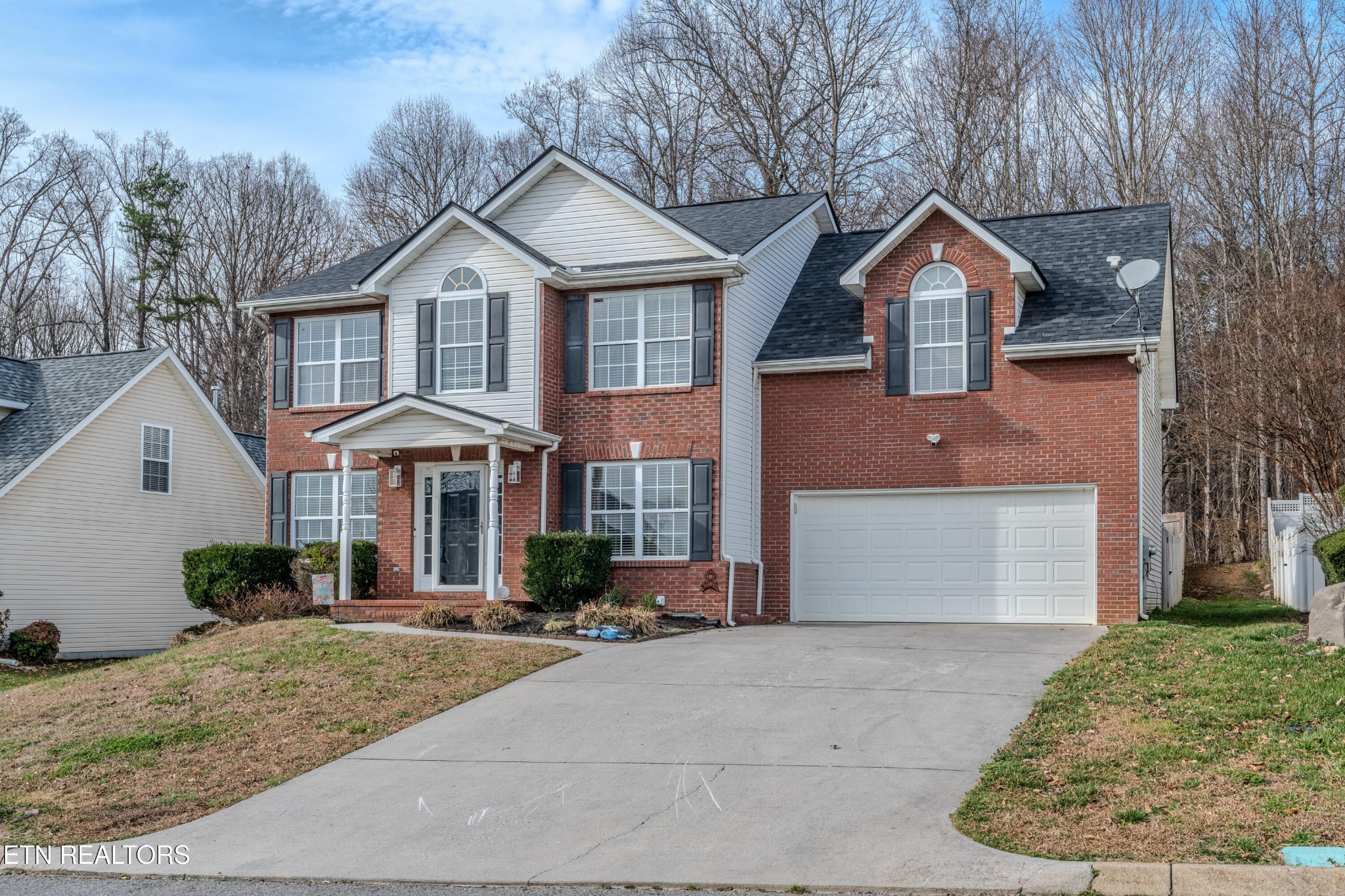 2805 Porch Swing Road Knoxville, TN 37938 - Photo 48 of 48 a front view of a house with garden