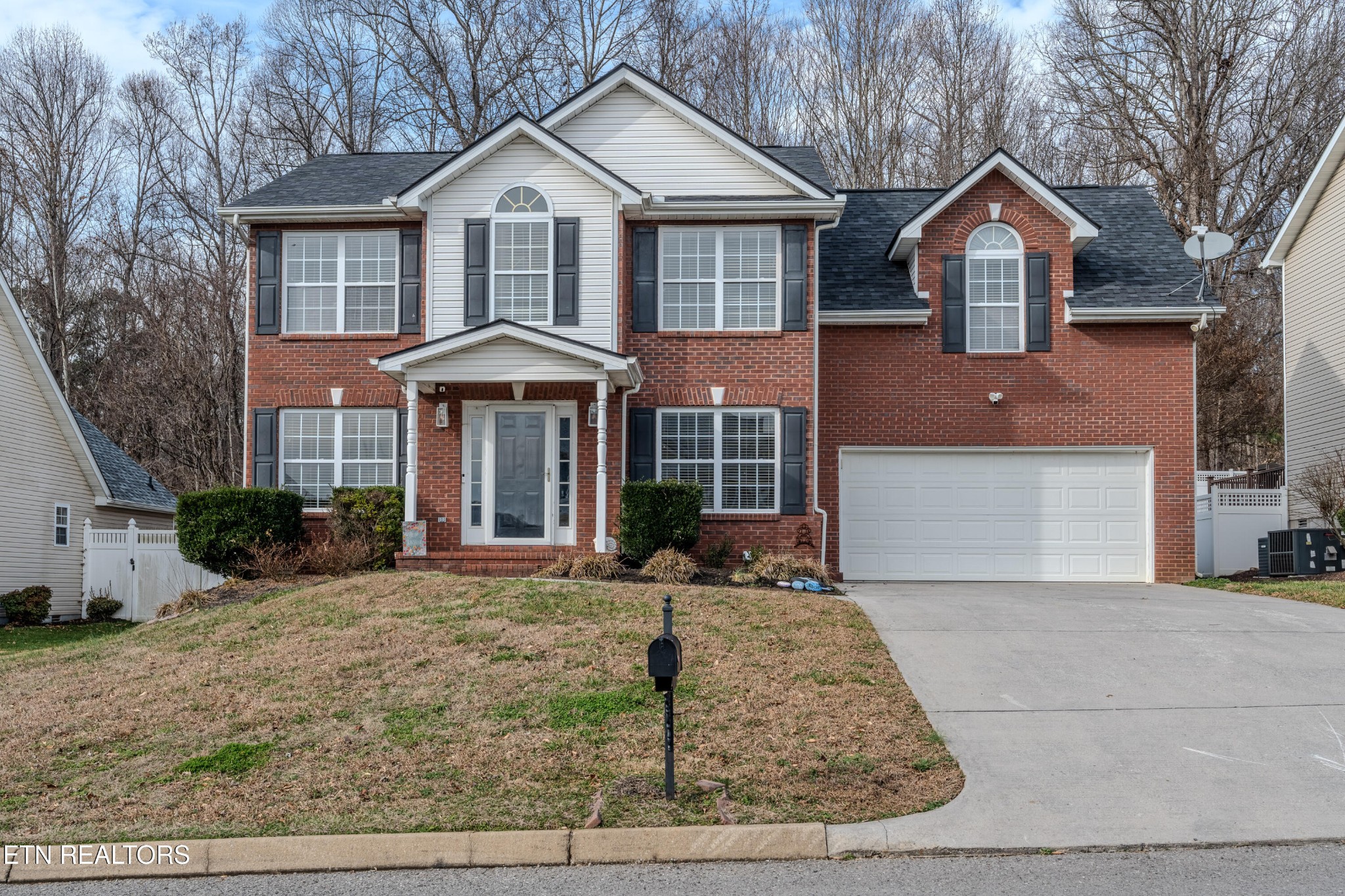 2805 Porch Swing Road Knoxville, TN 37938 - Photo 5 of 48 a front view of a house with yard