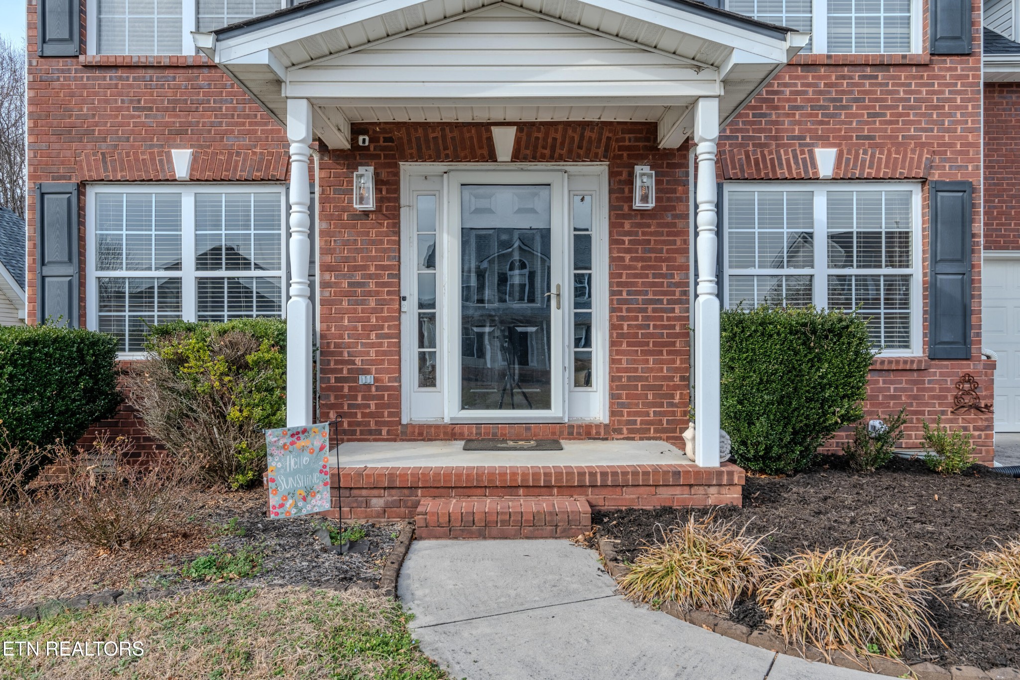 2805 Porch Swing Road Knoxville, TN 37938 - Photo 6 of 48 a front view of a house with a yard