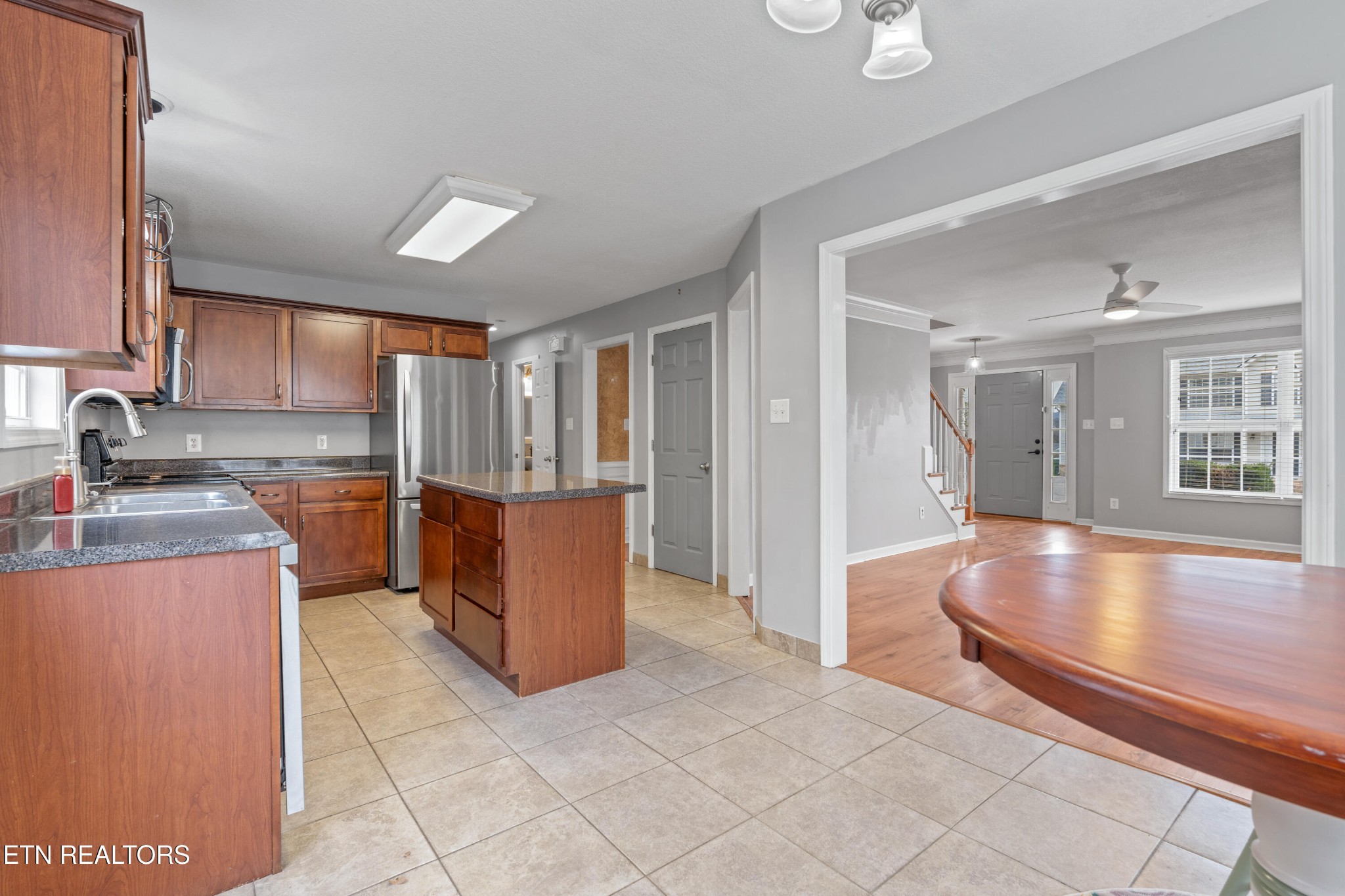 2805 Porch Swing Road Knoxville, TN 37938 - Photo 10 of 48 a kitchen with stainless steel appliances granite countertop a refrigerator a stove and a sink with granite countertops