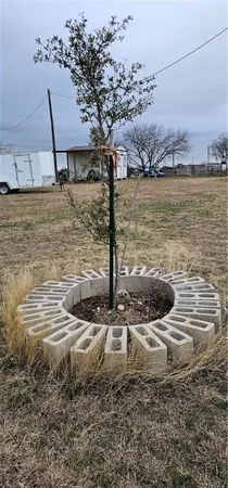 a view of a lake with a table and chairs