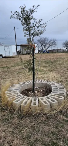 a view of a lake with a table and chairs