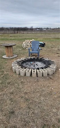 a view of a balcony with a yard