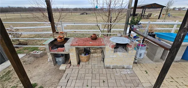 a view of a patio with a table chairs and a patio