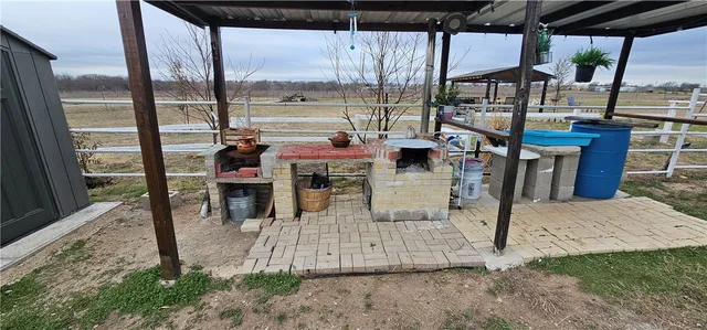 a view of a park with lawn chairs