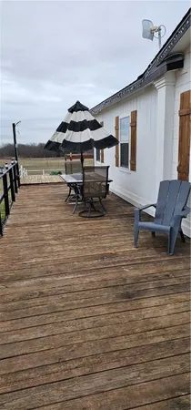 a view of pool chair in front of house