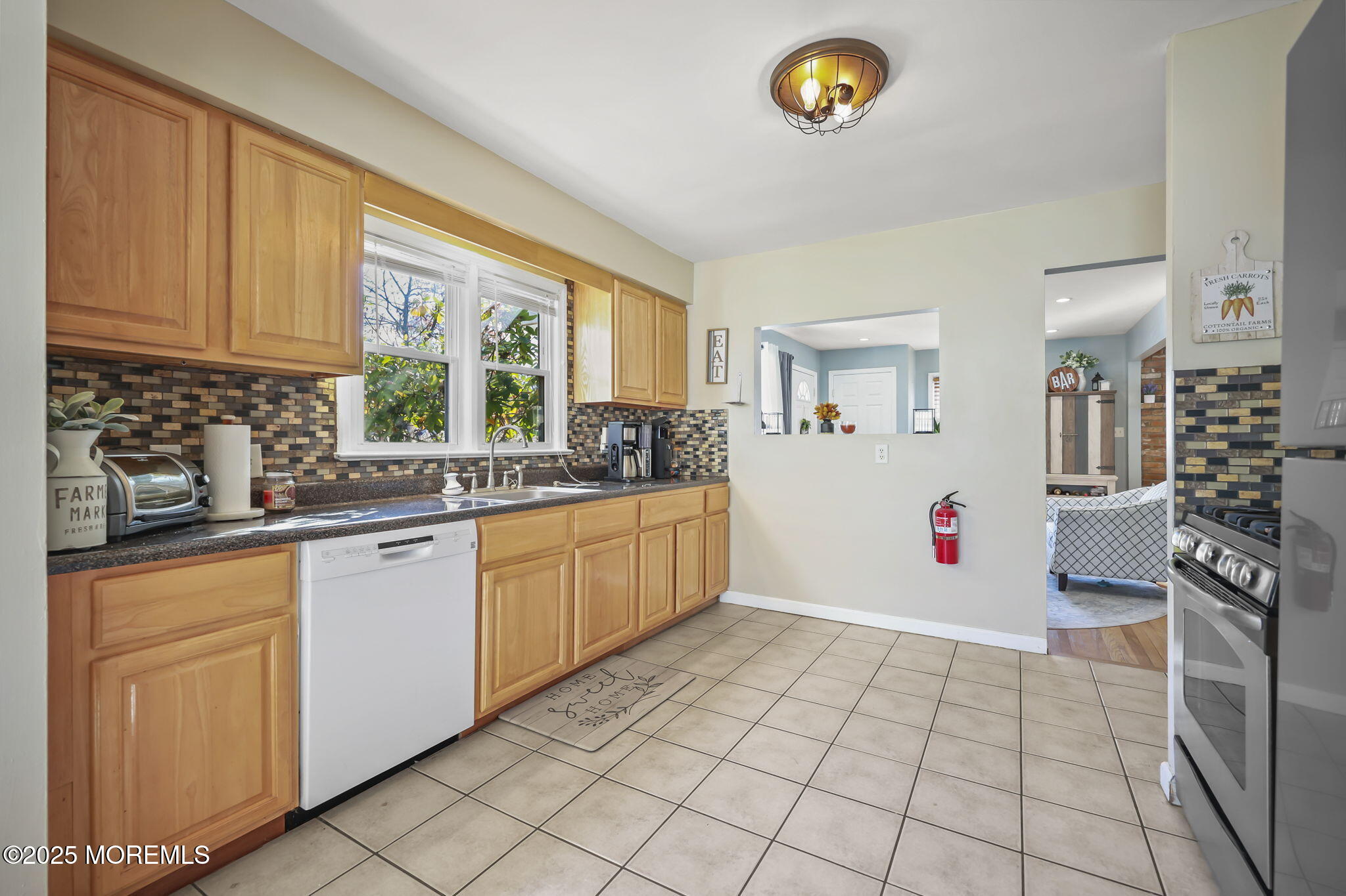 13 Holly Road Brick, NJ 08723 - Photo 16 of 34 a kitchen with a cabinets a sink and a window