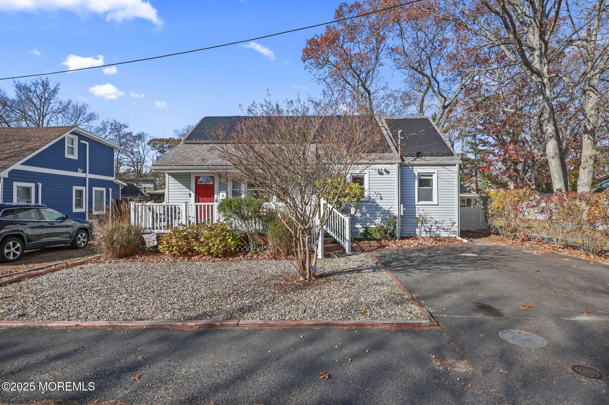 13 Holly Road Brick, NJ 08723 - Photo 3 of 34 a front view of a house with a yard