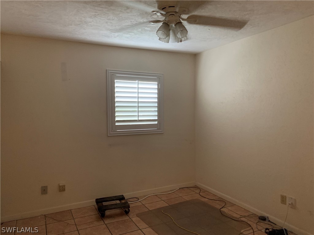 2219 Lily Road Fort Myers, FL 33905 - Photo 14 of 23 an empty room with a window