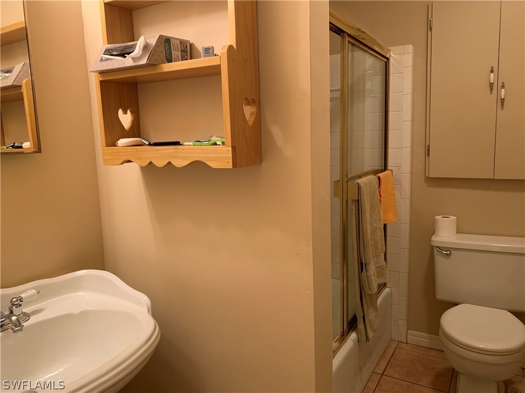 2219 Lily Road Fort Myers, FL 33905 - Photo 17 of 23 a bathroom with a toilet and a sink