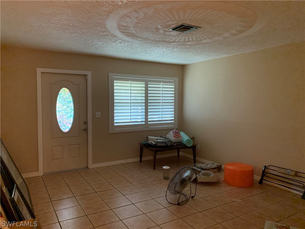 2219 Lily Road Fort Myers, FL 33905 - Photo 8 of 23 a room with furniture and window