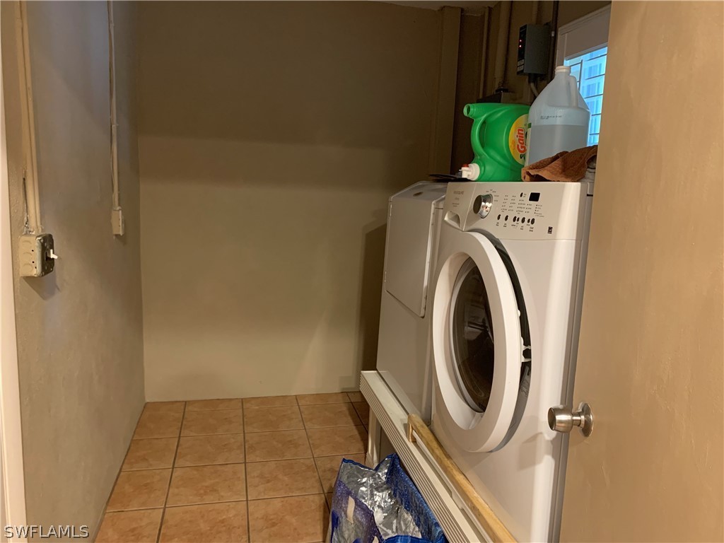 2219 Lily Road Fort Myers, FL 33905 - Photo 10 of 23 a utility room with dryer and washer