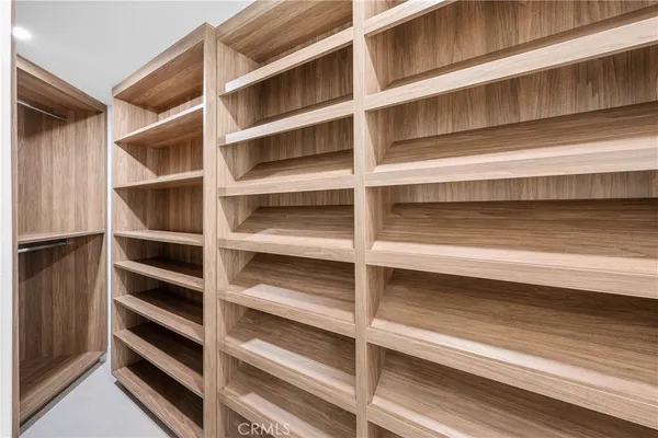 a bathroom with a double vanity sink mirror and bathtub