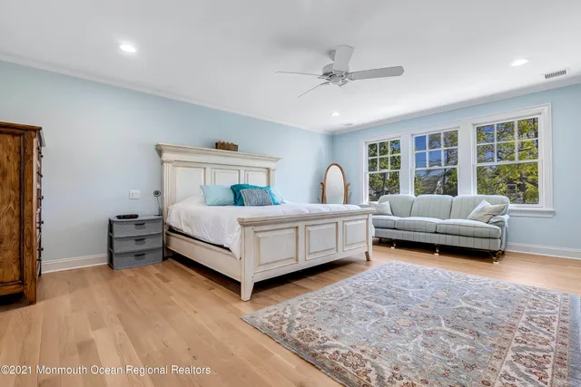 a bedroom with a bed and a couch