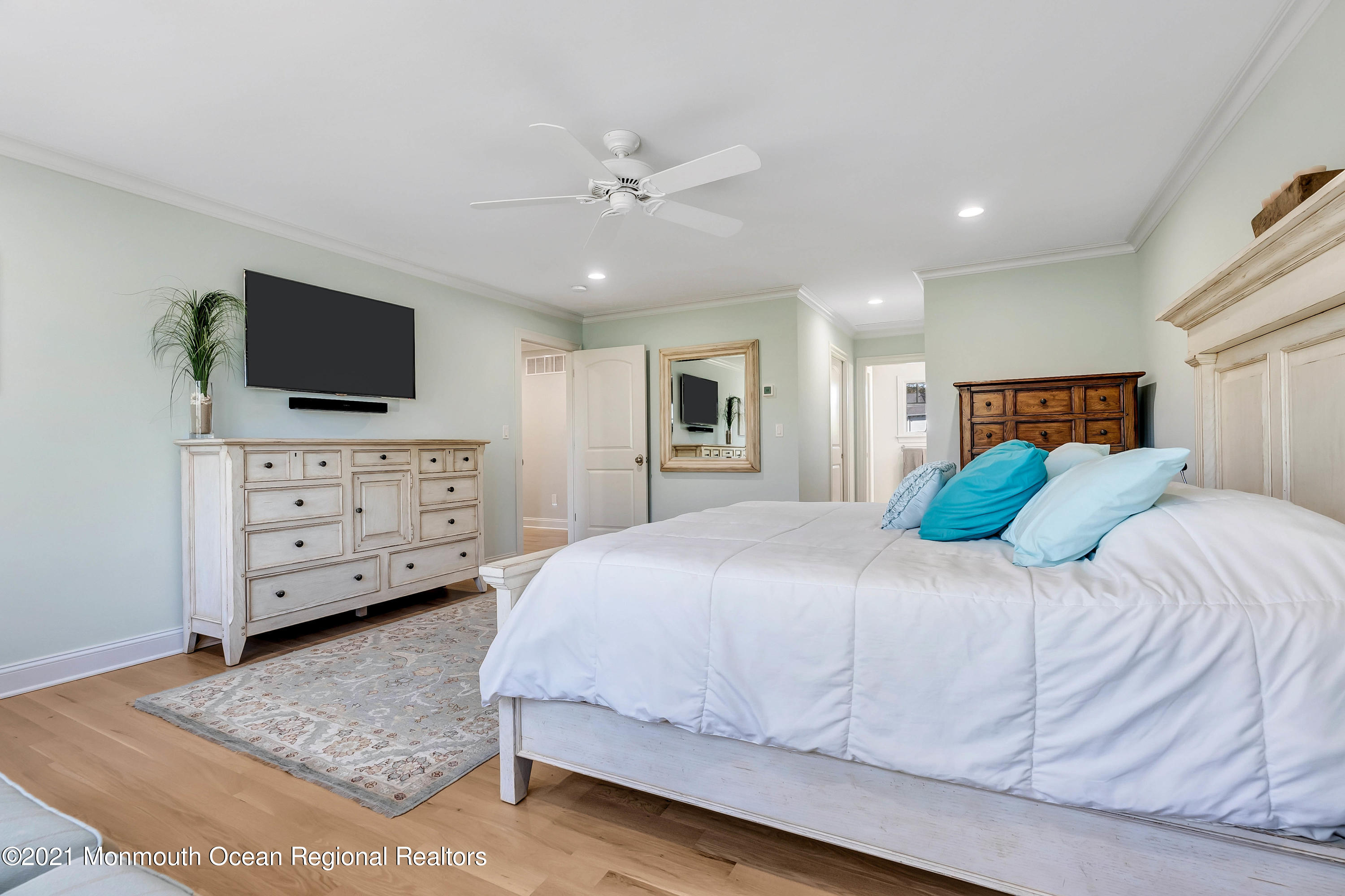 211 Monroe Avenue Spring Lake, NJ 07762 - Photo 20 of 46 a bedroom with a bed and a television