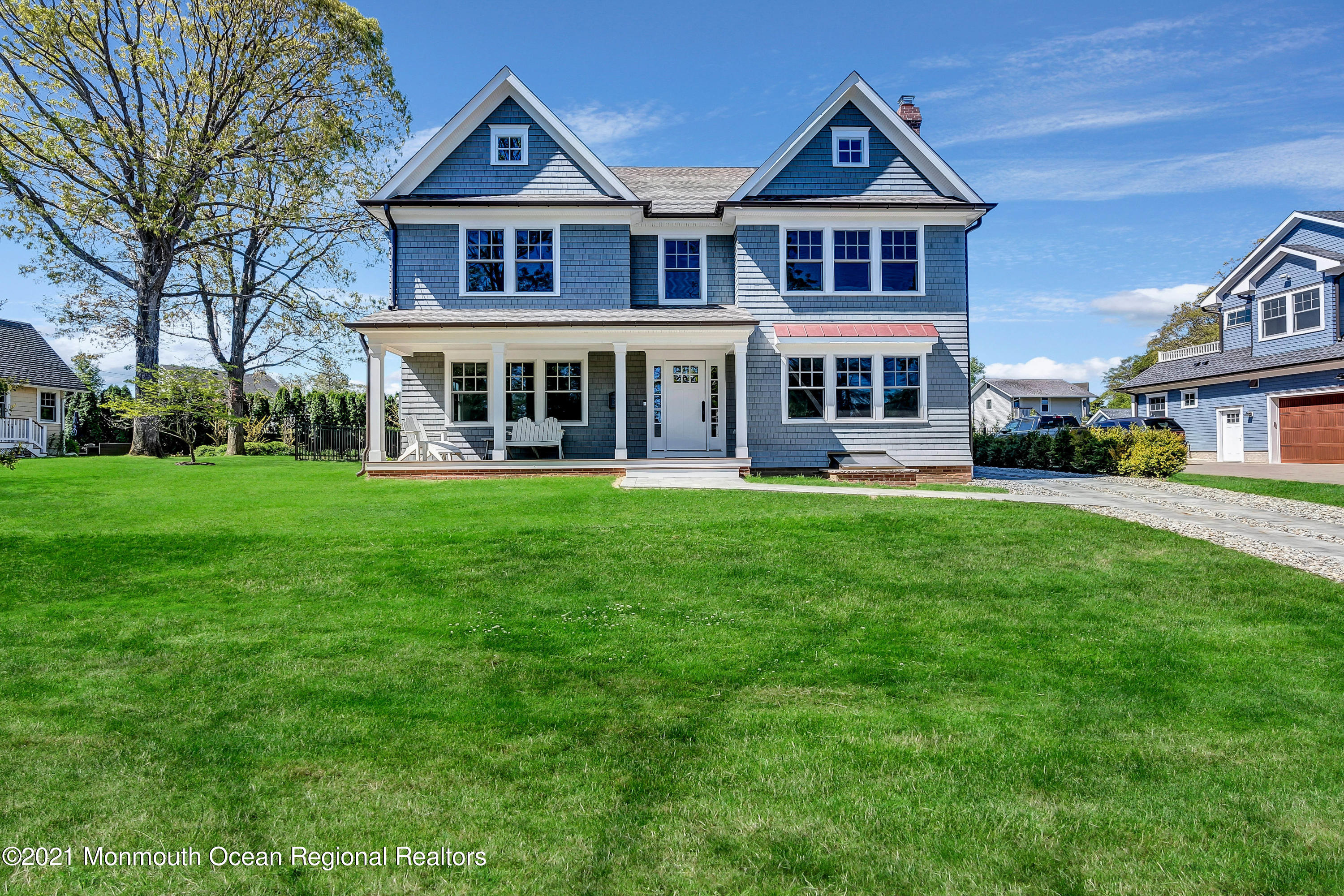 211 Monroe Avenue Spring Lake, NJ 07762 - Photo 2 of 46 a view of a house next to a big yard and large trees
