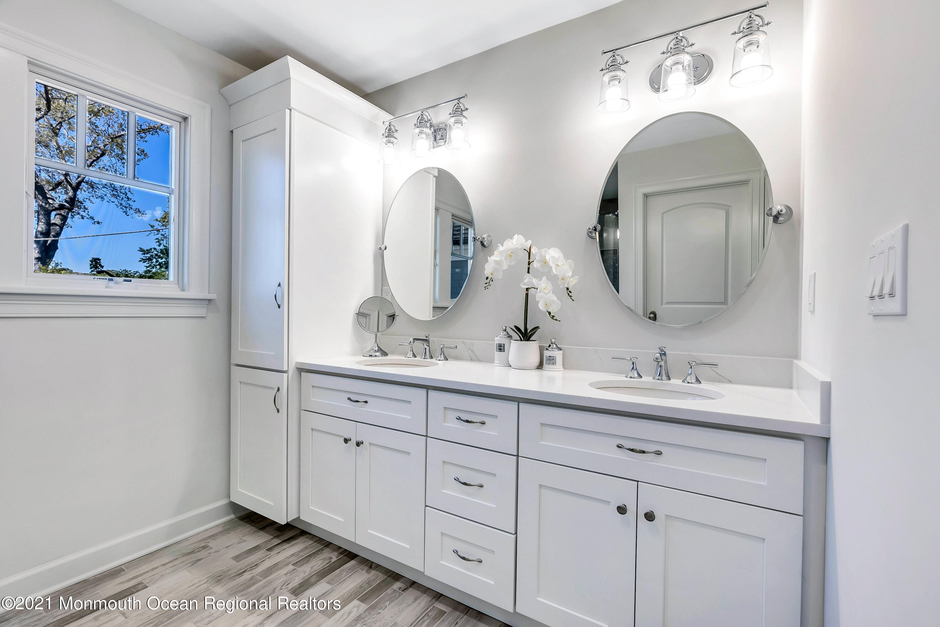 211 Monroe Avenue Spring Lake, NJ 07762 - Photo 21 of 46 a bathroom with double vanity sinks and a two mirror