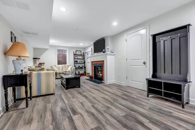 a view of kitchen with furniture flat screen tv and refrigerator