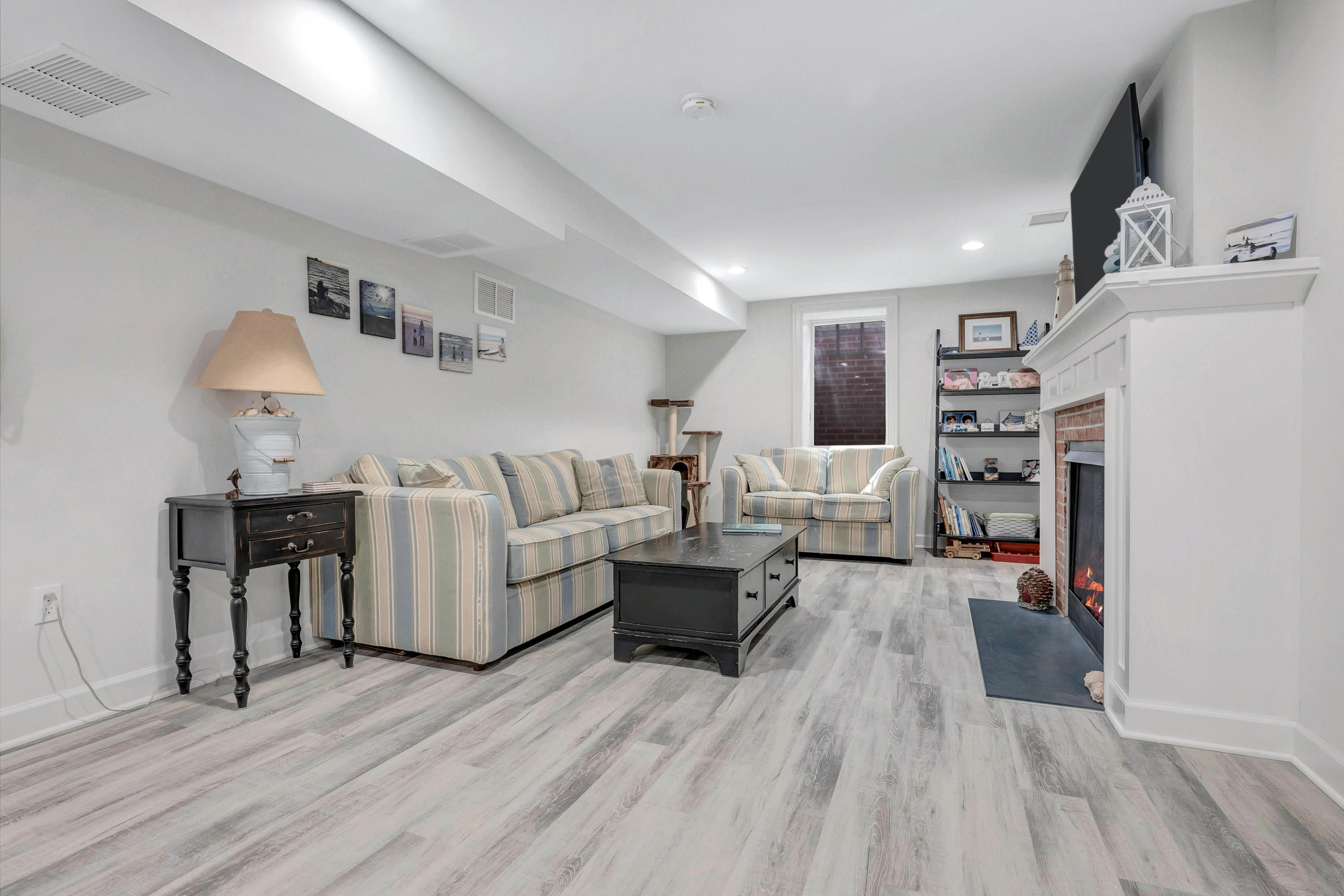 211 Monroe Avenue Spring Lake, NJ 07762 - Photo 35 of 46 a living room with furniture and a wooden floor