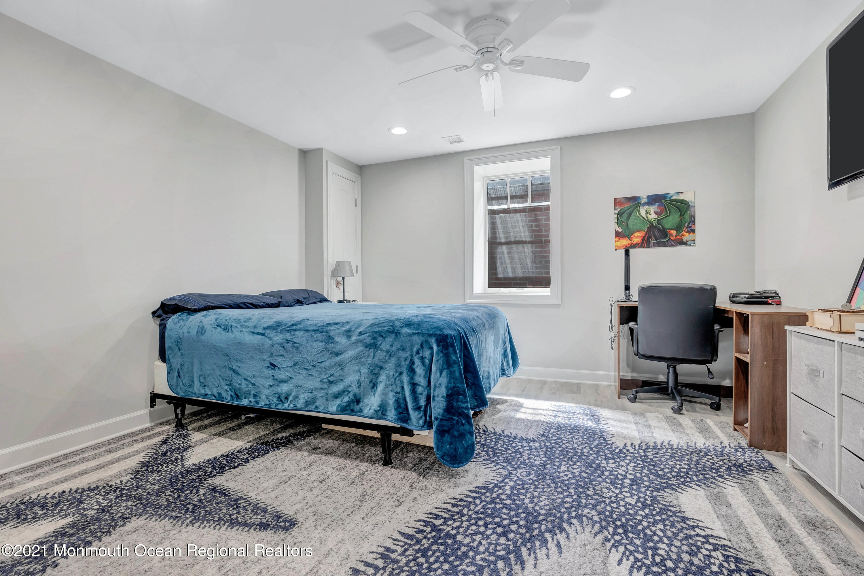 211 Monroe Avenue Spring Lake, NJ 07762 - Photo 38 of 46 a bedroom with a bed a desk and chair