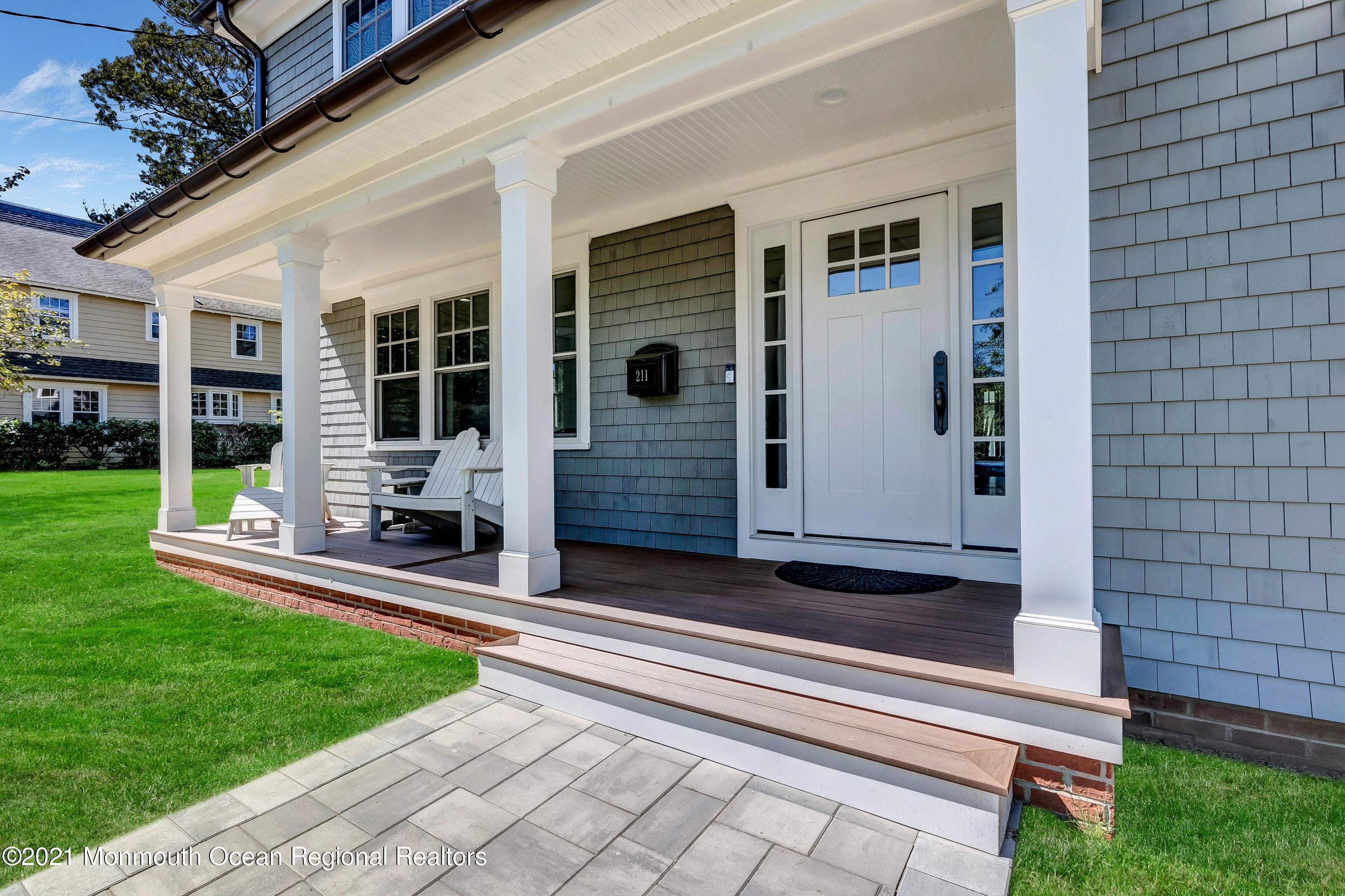 211 Monroe Avenue Spring Lake, NJ 07762 - Photo 4 of 46 a front view of a house with a yard