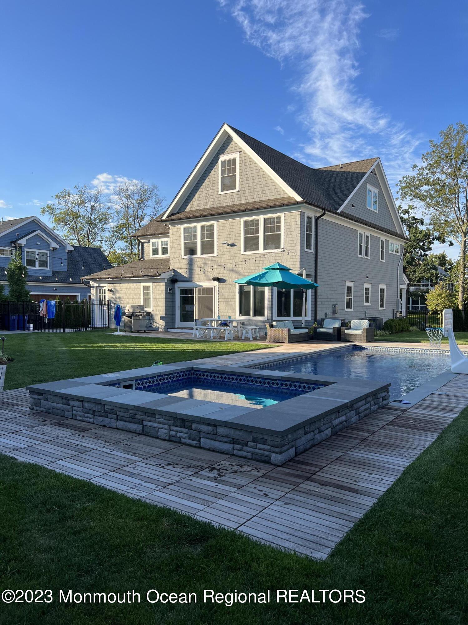 211 Monroe Avenue Spring Lake, NJ 07762 - Photo 41 of 46 a front view of a house with a yard