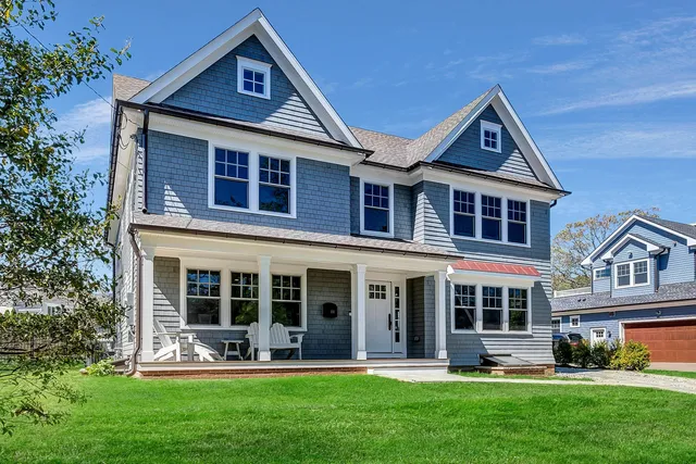 front view of a house with a yard