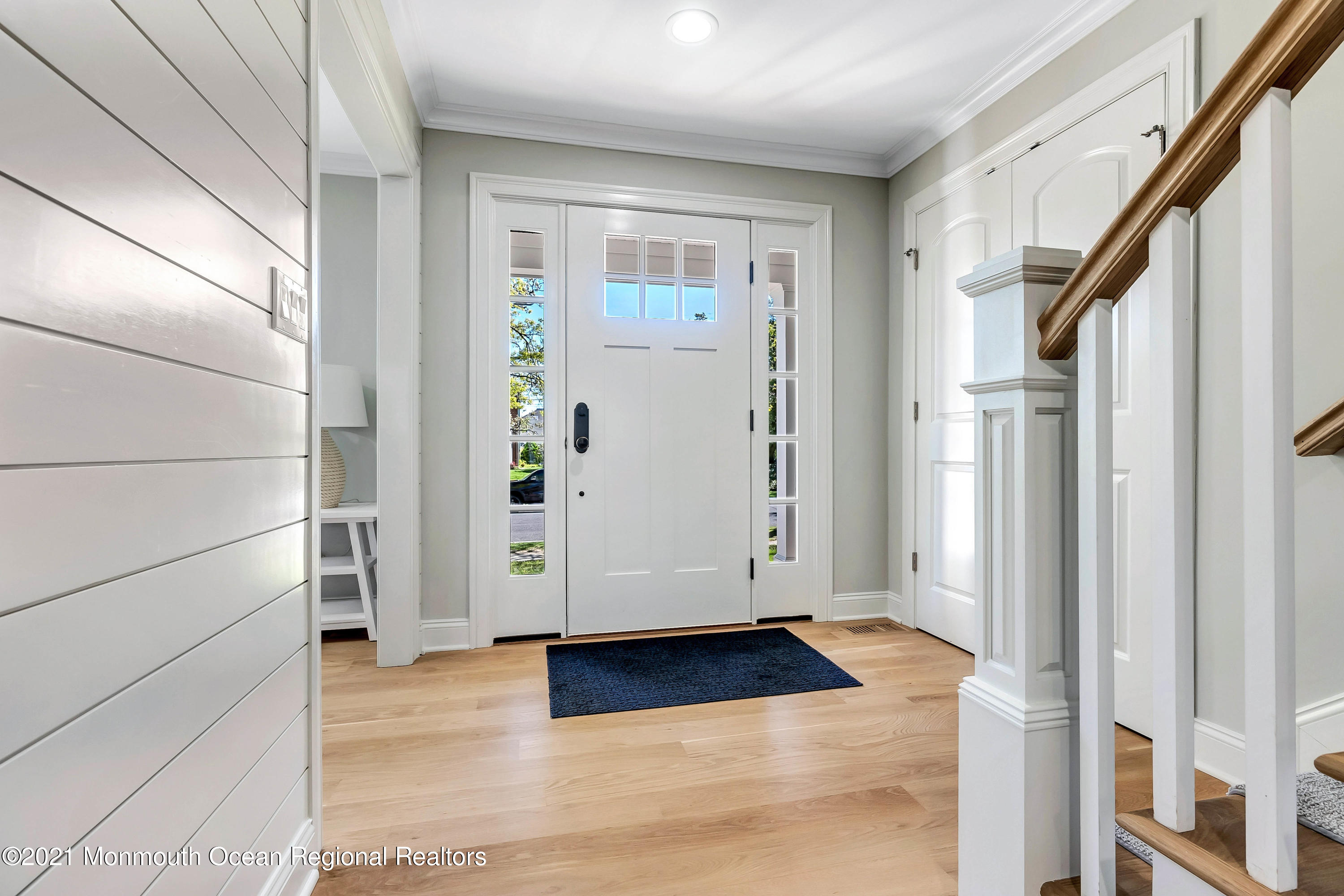 211 Monroe Avenue Spring Lake, NJ 07762 - Photo 5 of 46 a view of entryway with wooden floor and door