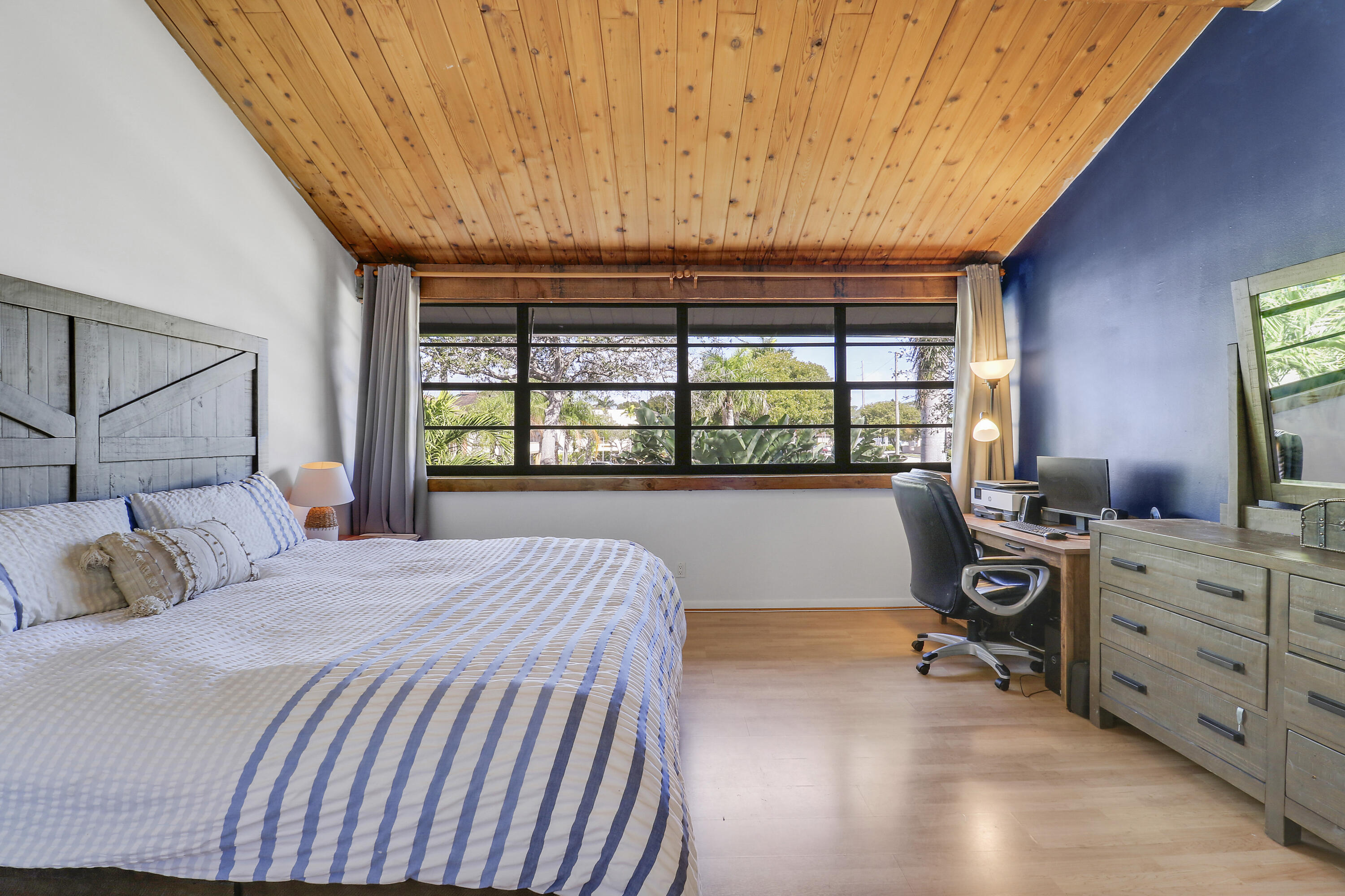 4801 Northwest 2nd Avenue, Unit 101 Boca Raton, FL 33431 - Photo 16 of 31 a bedroom with a bed and a window