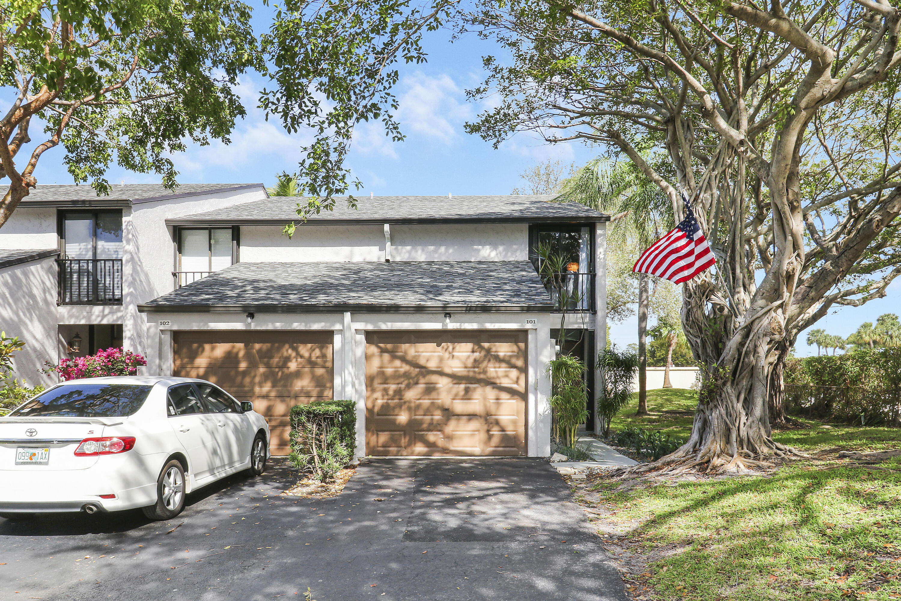 4801 Northwest 2nd Avenue, Unit 101 Boca Raton, FL 33431 - Photo 29 of 31 a view of a car park in front of a house
