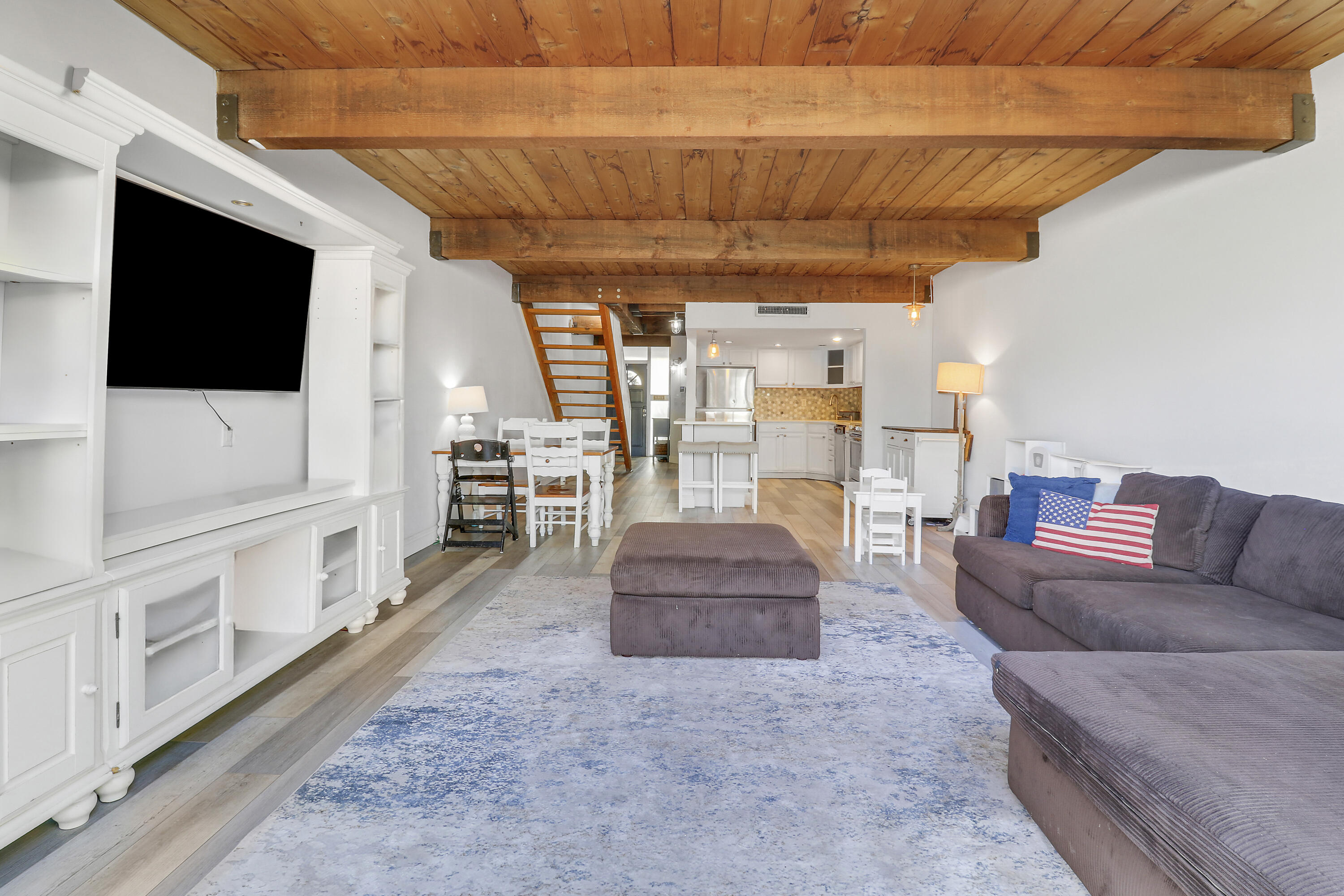 4801 Northwest 2nd Avenue, Unit 101 Boca Raton, FL 33431 - Photo 9 of 31 a living room with furniture and a flat screen tv