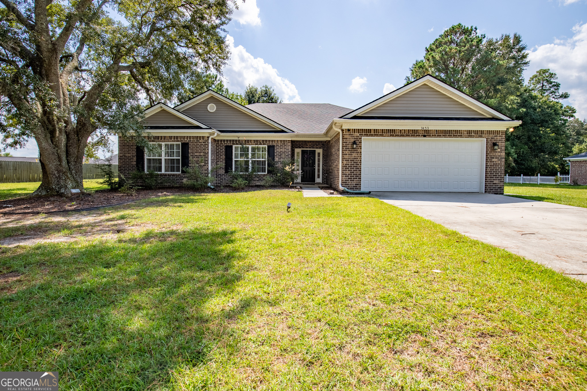 3453 John Wells Road Ludowici, GA 31316 - Photo 1 of 51 a front view of a house with a yard