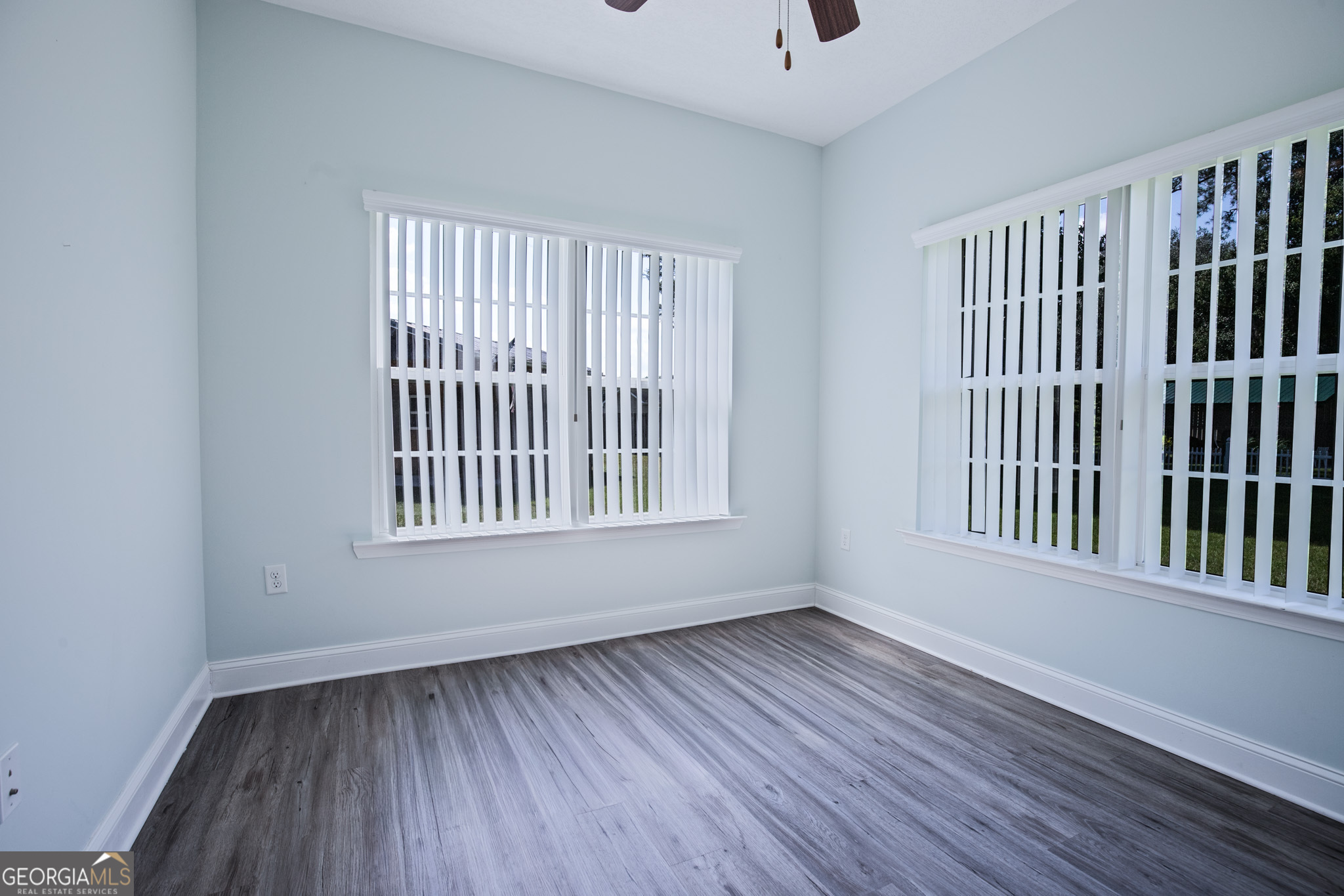 3453 John Wells Road Ludowici, GA 31316 - Photo 19 of 51 a view of an empty room with wooden floor and a window