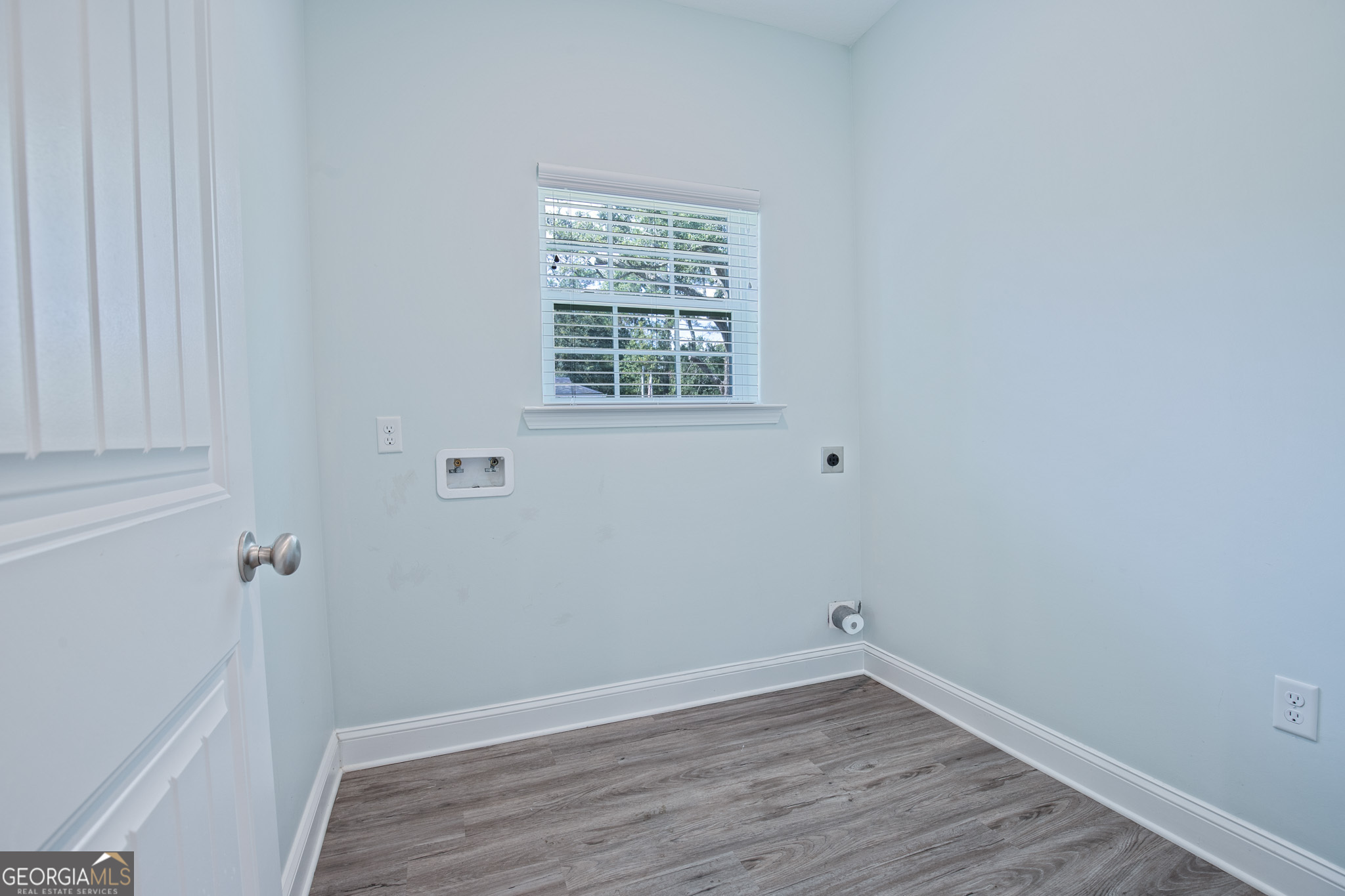 3453 John Wells Road Ludowici, GA 31316 - Photo 27 of 51 a view of an empty room with wooden floor and a window