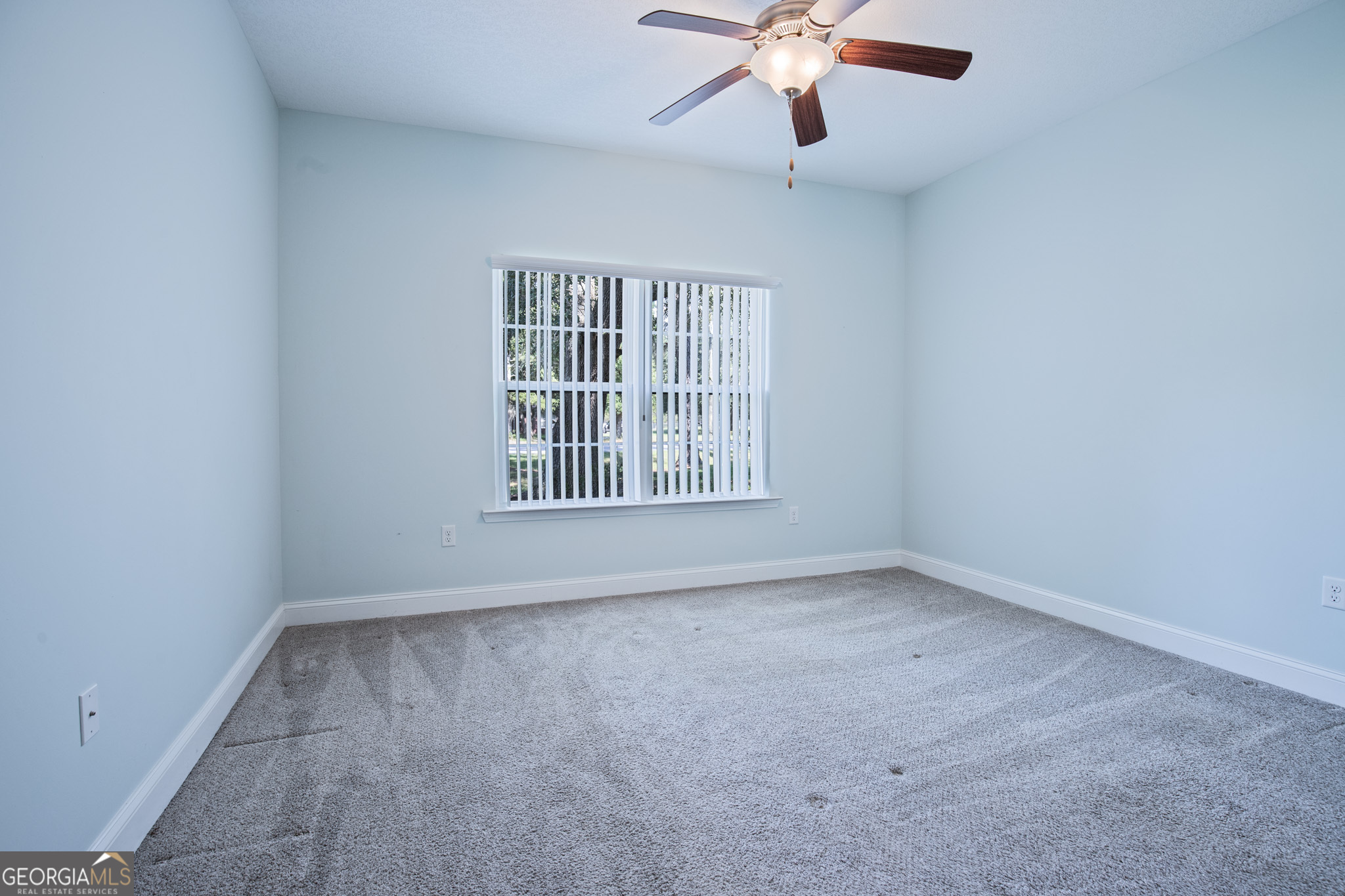 3453 John Wells Road Ludowici, GA 31316 - Photo 30 of 51 an empty room with a window and a fan