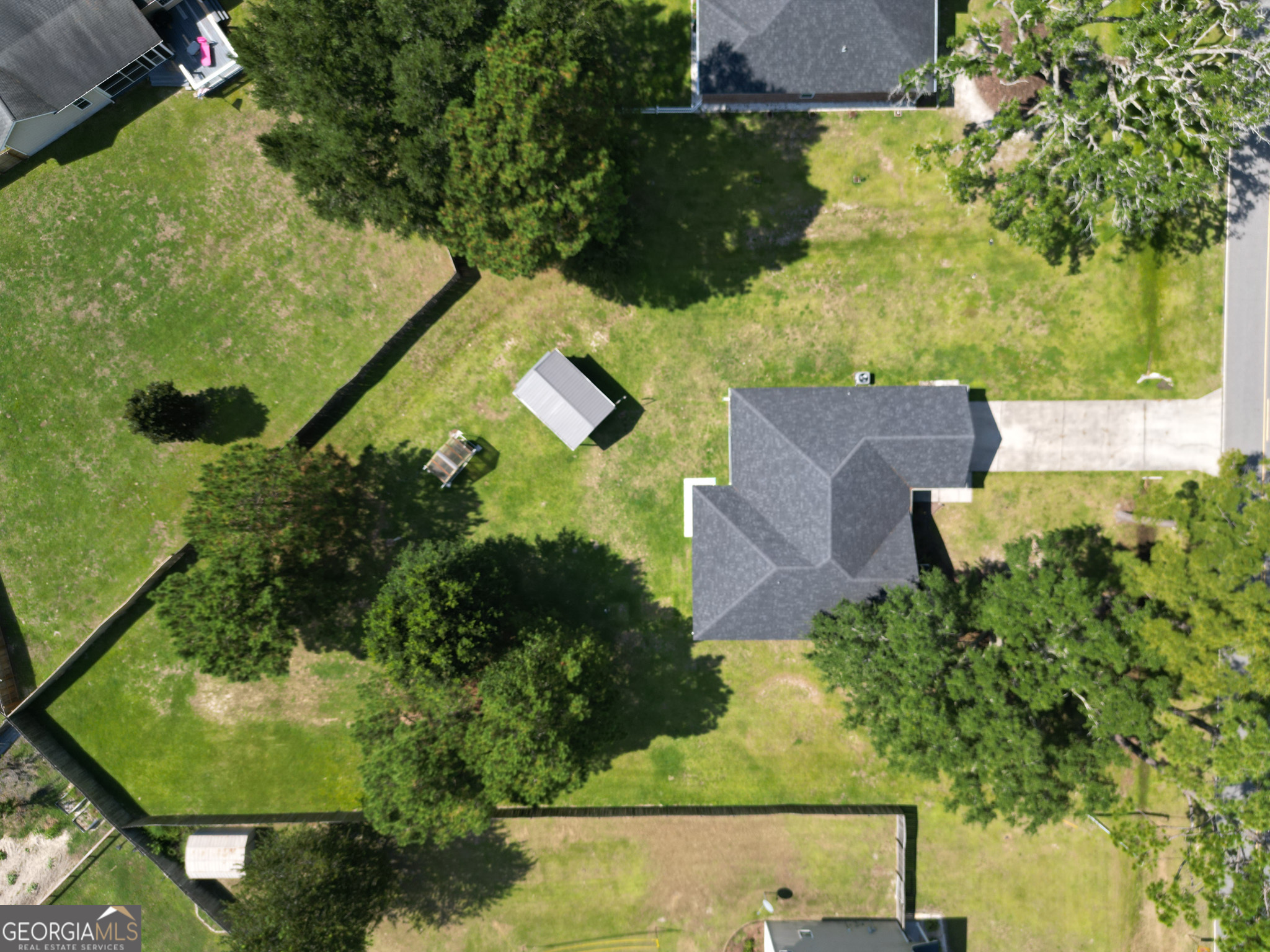 3453 John Wells Road Ludowici, GA 31316 - Photo 3 of 51 an aerial view of a house with a yard basket ball court and outdoor seating