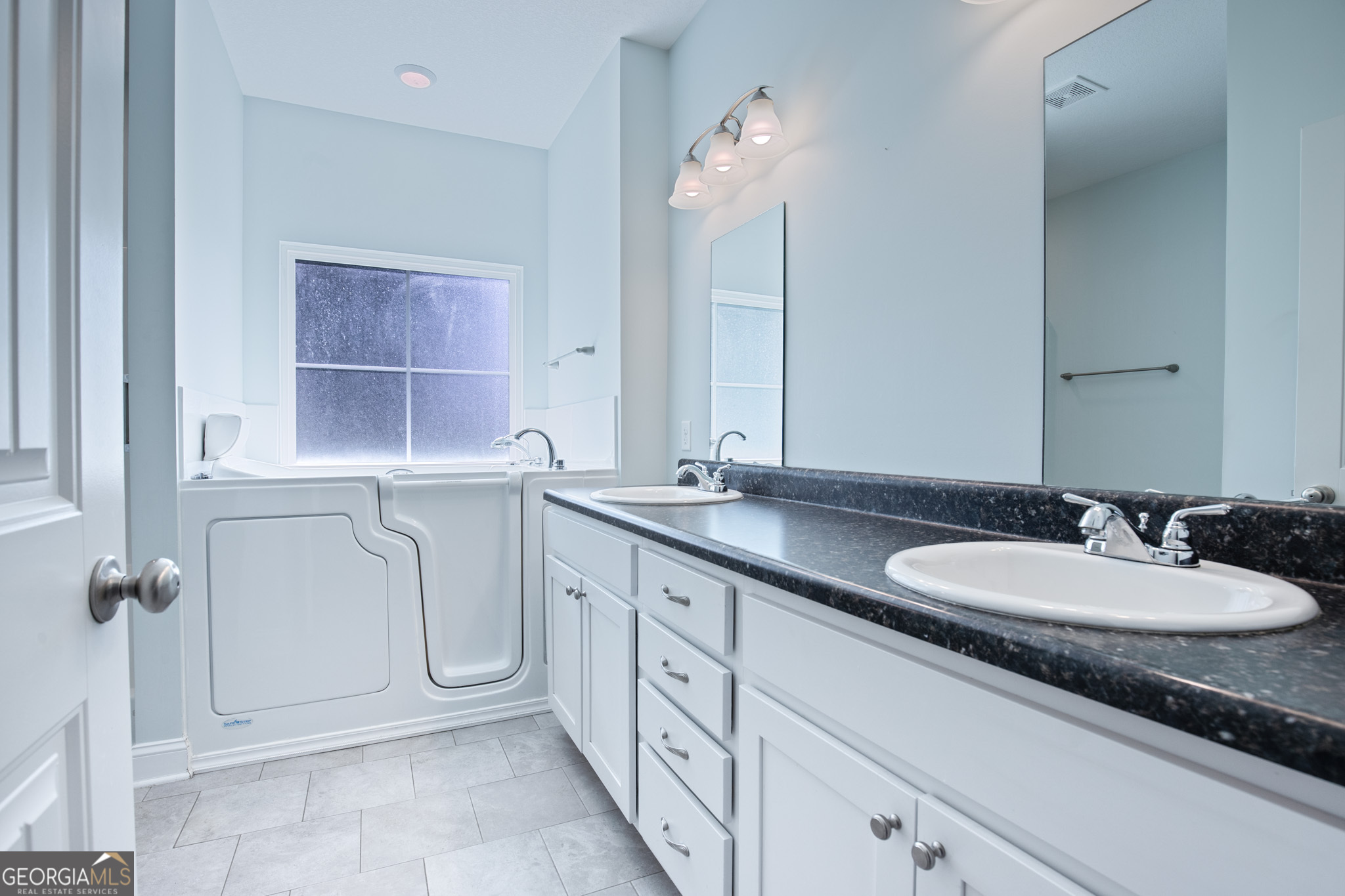 3453 John Wells Road Ludowici, GA 31316 - Photo 42 of 51 a bathroom with a double vanity sink mirror and