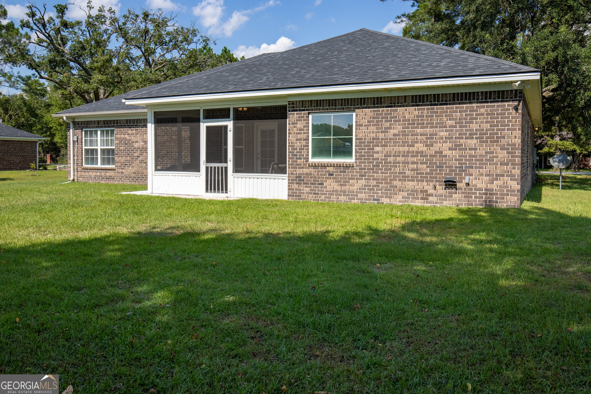 3453 John Wells Road Ludowici, GA 31316 - Photo 50 of 51 a front view of a house with a yard