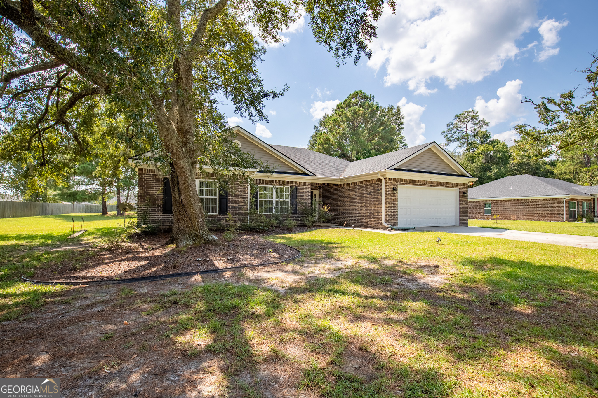 3453 John Wells Road Ludowici, GA 31316 - Photo 10 of 51 a front view of a house with a yard