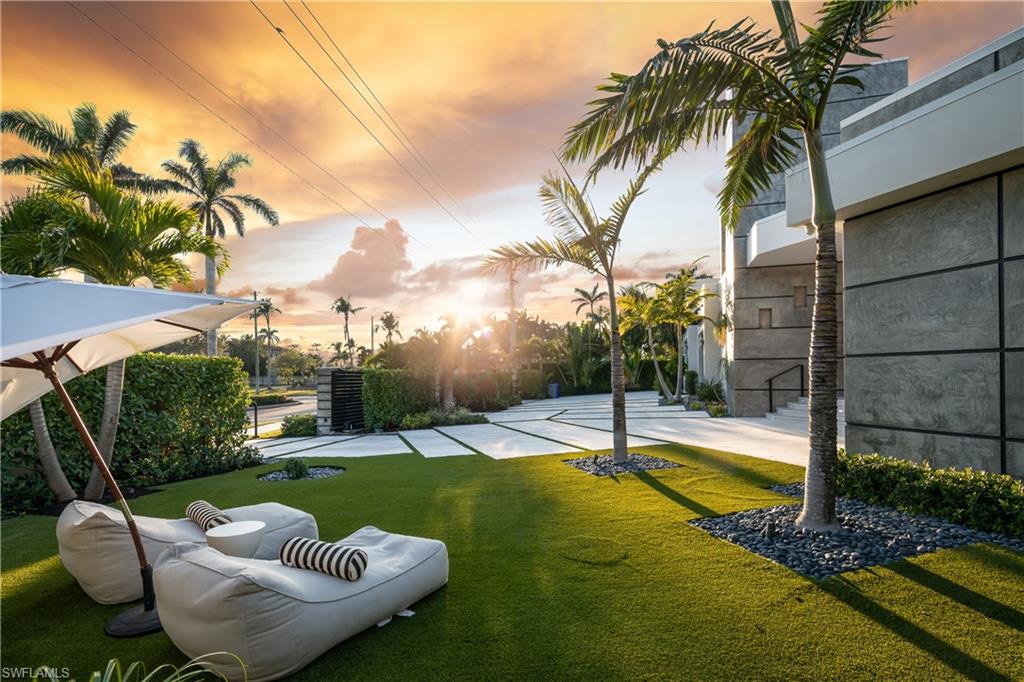 441 Mooring Line Drive Naples, FL 34102 - Photo 11 of 50 a view of a swimming pool with a patio
