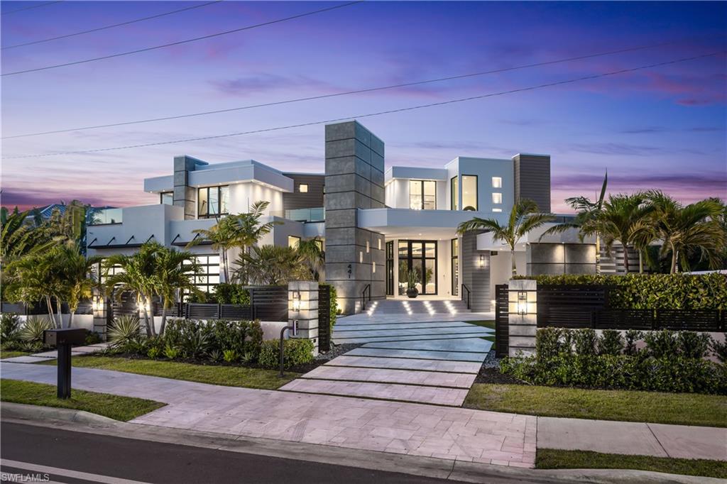 441 Mooring Line Drive Naples, FL 34102 - Photo 12 of 50 a front view of a building with street view