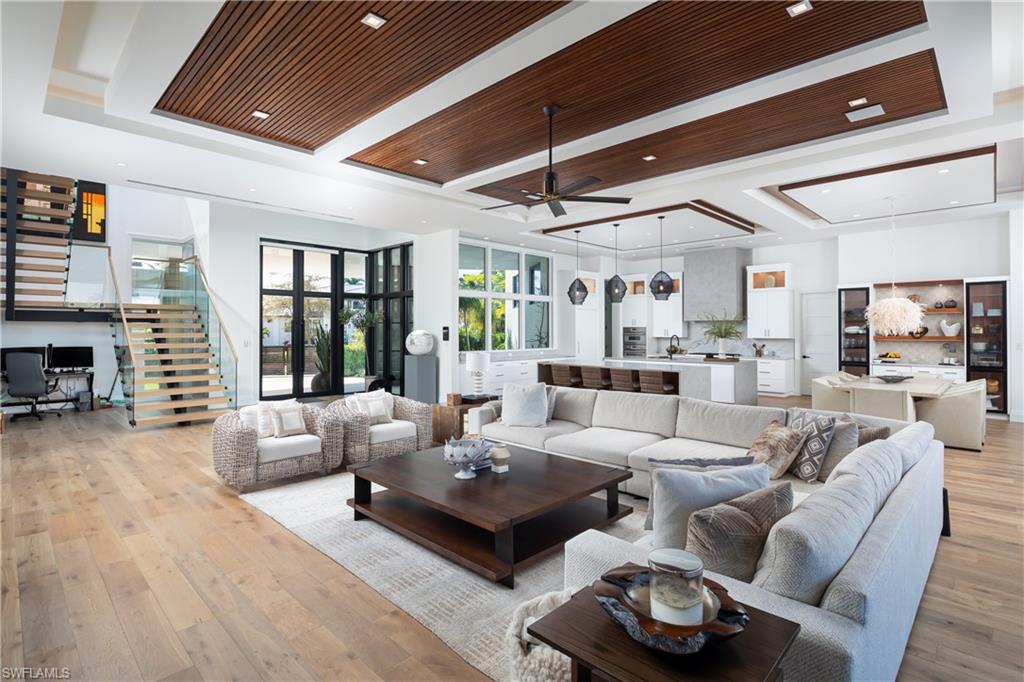 441 Mooring Line Drive Naples, FL 34102 - Photo 15 of 50 a living room with furniture and a large window