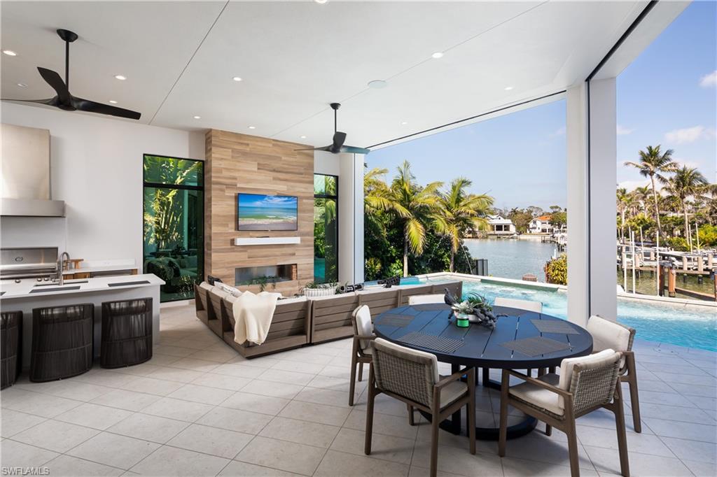 441 Mooring Line Drive Naples, FL 34102 - Photo 23 of 50 a view of a dining room with furniture window and outside view
